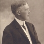 Black and white photograph of man in a suit