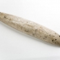 Colour image of long, narrow stone tool